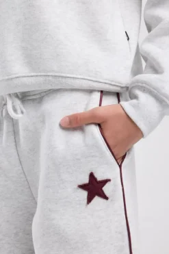 Joggingbroek Cassia Jr wide leg joggingbroek met bordeaux piping